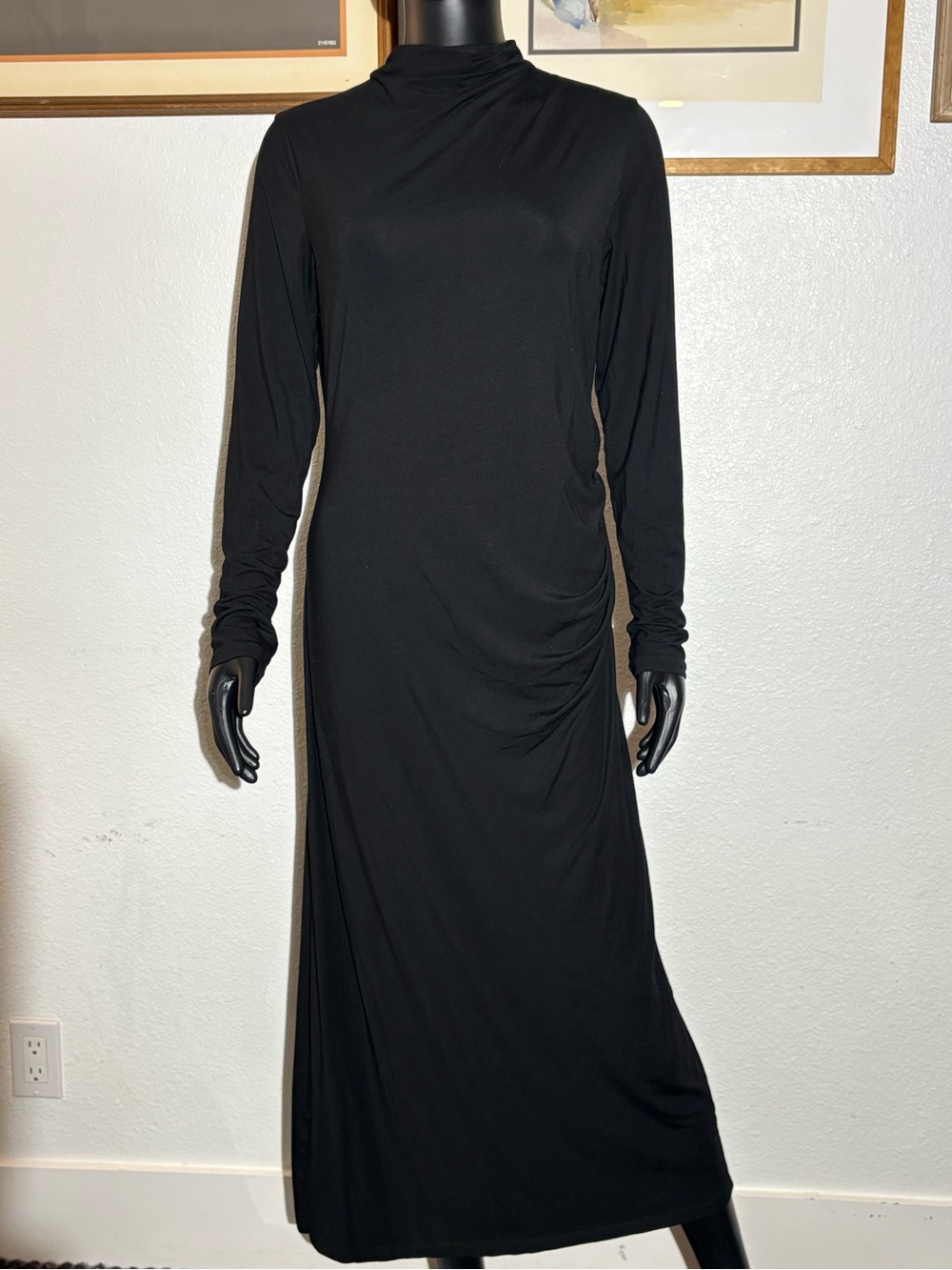 This is a Vince Long-Sleeve Ruched Turtleneck Midi Dress in black